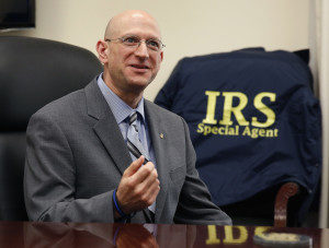 The Internal Revenue Service's Criminal Investigative Division Chief Richard Weber speaks inside his office in Washington, August 14, 2014. Budget pressures at the division are cutting the number of investigators there to the lowest level in four decades, and officials say the changes are forcing the division to scale back its fight of financial crime. Weber in an interview said his goal is to get the number of special agents back up to at least 3,000. Picture taken August 14, 2014. To match IRS-ENFORCEMENT/BUDGET REUTERS/Larry Downing (UNITED STATES - Tags: POLITICS CRIME LAW BUSINESS) - RTR43N9A