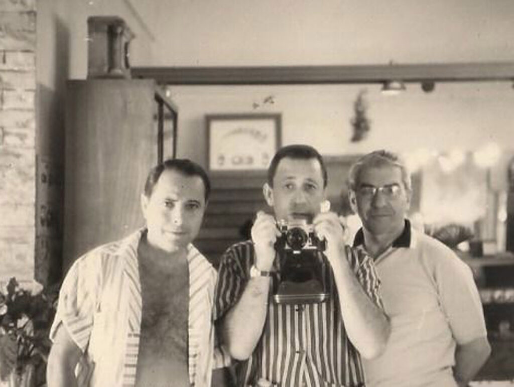 Barnett Glassmen, left, and Martin Gosch, center, pose for a photograph with an aging Luciano. Luciano allowed them to make a film about his life, but it never materialized. Gosch later wrote a biography of Luciano. Cipollini Collection