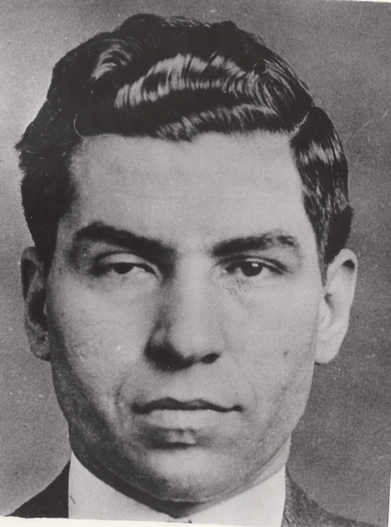 Charles “Lucky” Luciano, well known by his facial scars and drooping eye, was abducted by assailants who left him for dead. This 1931 mugshot shows the slight disfigurements he received. Cipollini Collection