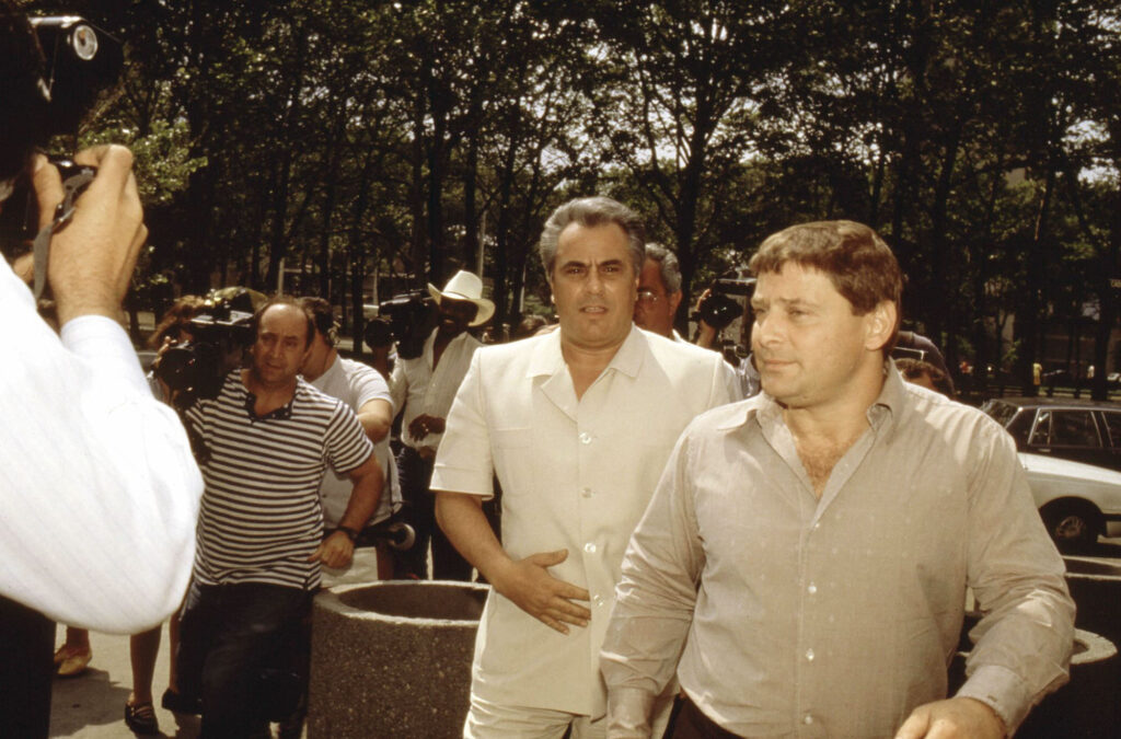 John Gotti, left, walks into a Brooklyn federal courthouse with Sammy “The Bull” Gravano, right, in May 1986. Gravano later testified against Gotti. Getty Images / Yvonne Hemsey