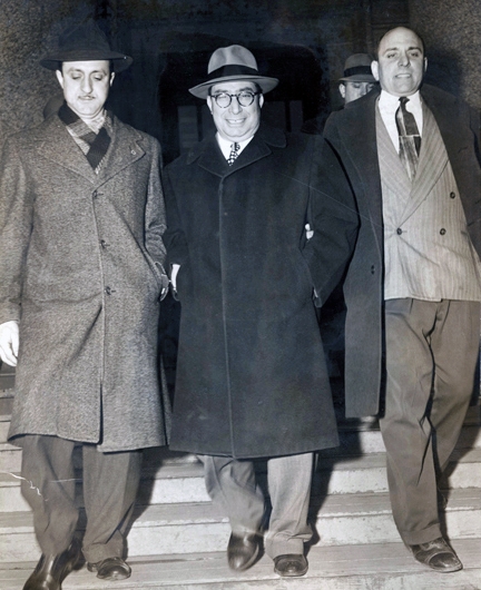 Salvatore Sollazzo, center, leaves federal court on March 7, 1951. The Genovese crime family associate was at the epicenter of the 1951 point-shaving scandal involving college basketball athletes. U.S. Customs and Border Protection