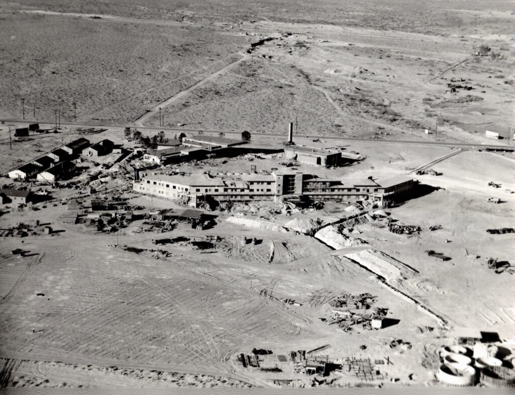 Aerial view of the Flamingo Hotel under construction in Las Vegas, mid-1940s. The resort would later become inseparable from Bugsy Siegel—and, by association, Virginia Hill. Courtesy of Cipollini Collection