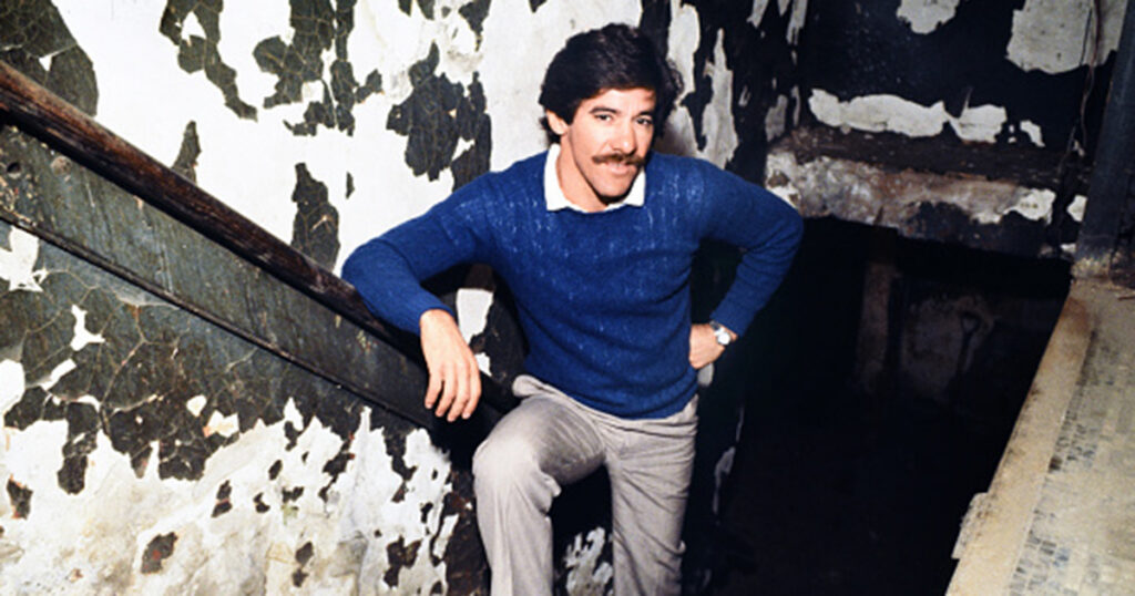 Geraldo Rivera poses on the stairs heading down to the Lexington Hotel’s basement, where Al Capone supposedly kept a hidden vault. Forty years ago, millions of Americans tuned in to watch Rivera’s two-hour live television special revealing the contents of the “vault.” Steve Kagan / Getty Images