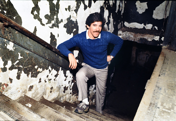 Geraldo Rivera poses on the stairs heading down to the Lexington Hotel’s basement, where Al Capone supposedly kept a hidden vault. Forty years ago, millions of Americans tuned in to watch Rivera’s two-hour live television special revealing the contents of the “vault.” Steve Kagan / Getty Images