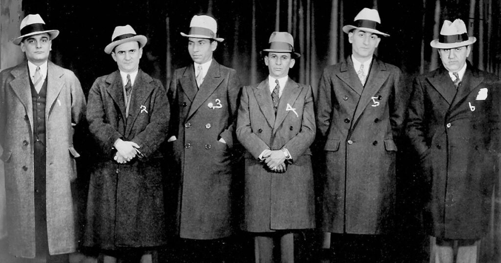 Men in a police lineup display their “mobster chic,” including Lucky Luciano (3) and Meyer Lansky (4). The John Binder Collection