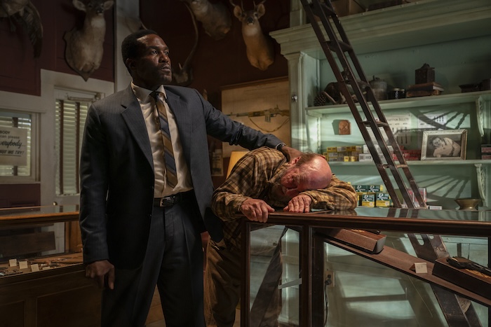 In By Any Means, Yahya Adbul-Mateen II, left, best known for his role in the Aquaman films, plays a young FBI agent assigned to partner with infamous Mafia hitman Gregory Scarpa Sr. to investigate the disappearances of three civil rights workers in Mississippi. Paramount Pictures