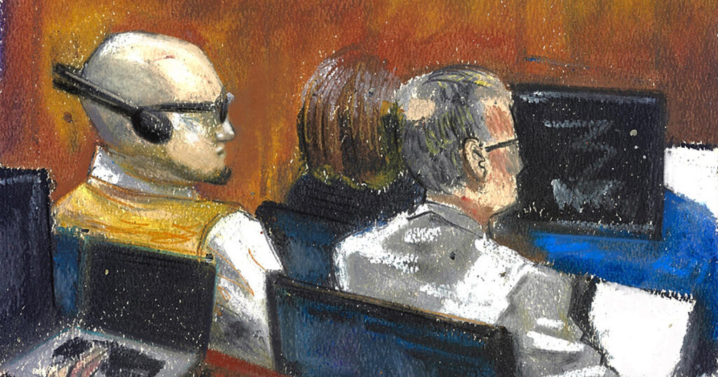 MS-13 member Jose Luis Reynaldo Reyes-Castillo, left, listens to an interpreter through headphones next to his attorney during his murder trial in Las Vegas. The Mob Museum Collection