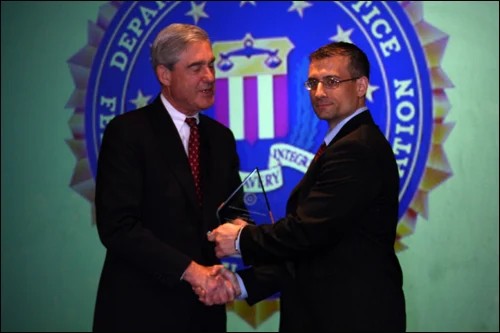 Joseph Tripi has led the investigation showing that the Buffalo Mob is still a key player in Upstate New York’s underworld. Tripi, right, receives a leadership award in 2011 from then-FBI director Robert Mueller. Federal Bureau of Investigation