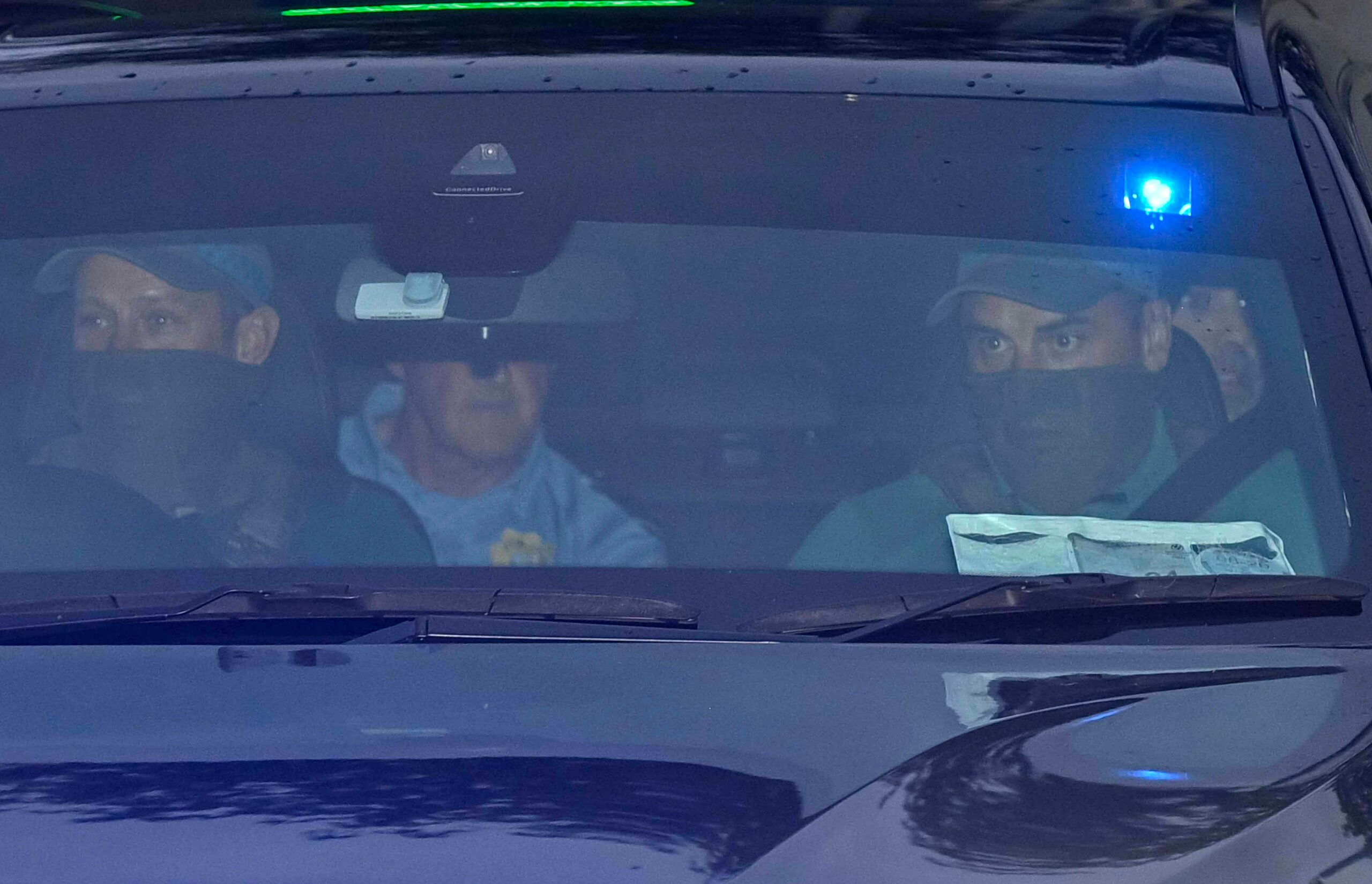 Daniel Kinahan, back right, is escorted by police after leaving the Criminal Courts of Justice in Dublin shortly after his extradition from Dubai. Mark Marlow/PA Wire IRISH (Press Association via AP Images)