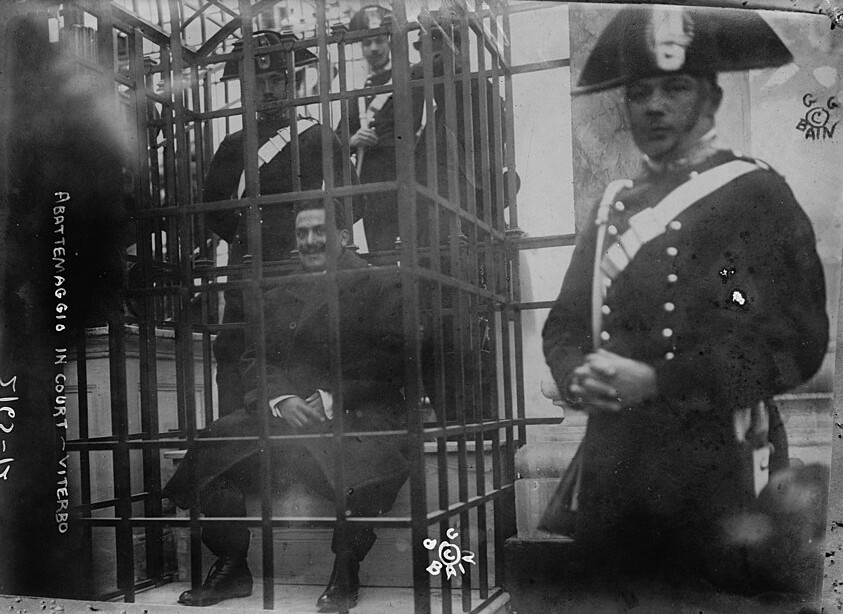 Abbatemaggio sits in an iron cage as he testifies against the Camorra at the Viterbo Trial, c. 1911. Library of Congress